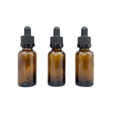 O cosmético 30ml de vidro ambarino engarrafa o óleo essencial com o conta-gotas do fechamento da catraca