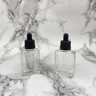 O cosmético de vidro do quadrado 30ml engarrafa o tampão sem perigo para as crianças do conta-gotas para o óleo dos cuidados capilares